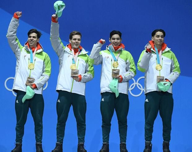 Burján Csaba (balra), Knoch Viktor, Liu Shaoang, Liu Shaolin – az olimpiai dobogó felső fokán (Fotó: Getty Images)