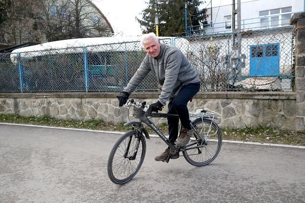 István Vaskuti on a bicycle...