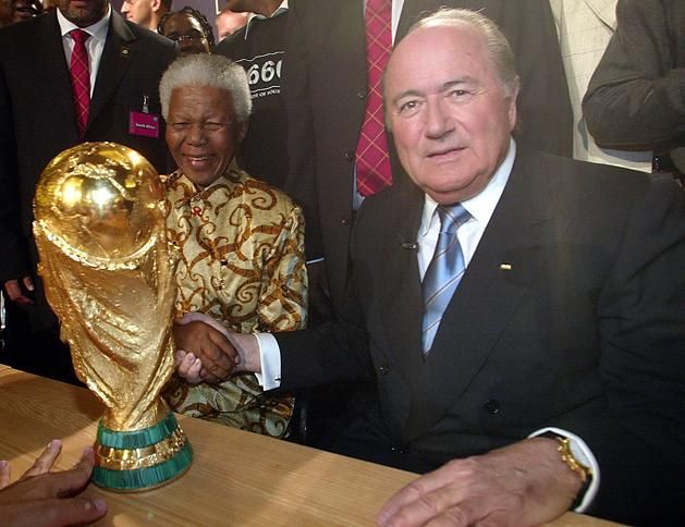 Former South African president Nelson Mandela (left) shakes hands with FIFA president Joseph Blatter.
