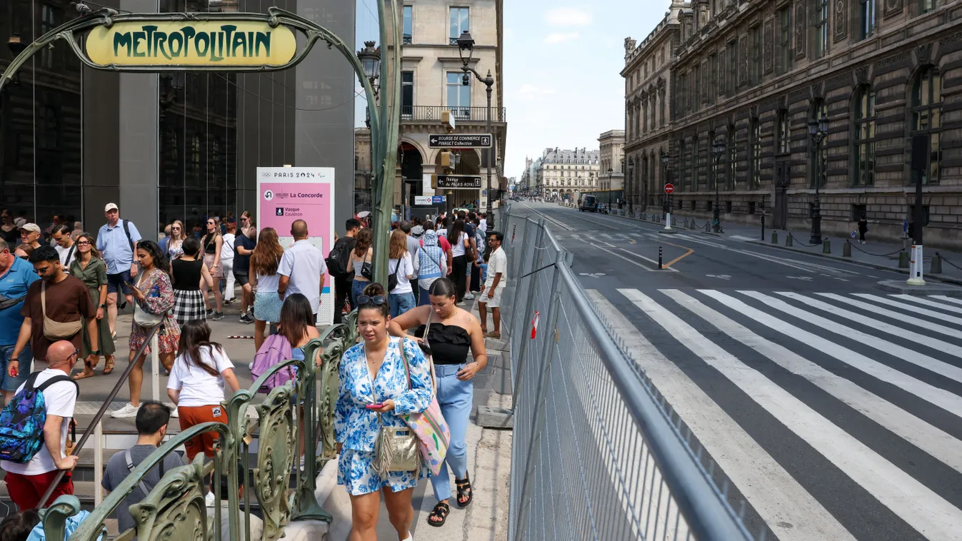 People exit the Metro station at the Louvre museum, in Paris