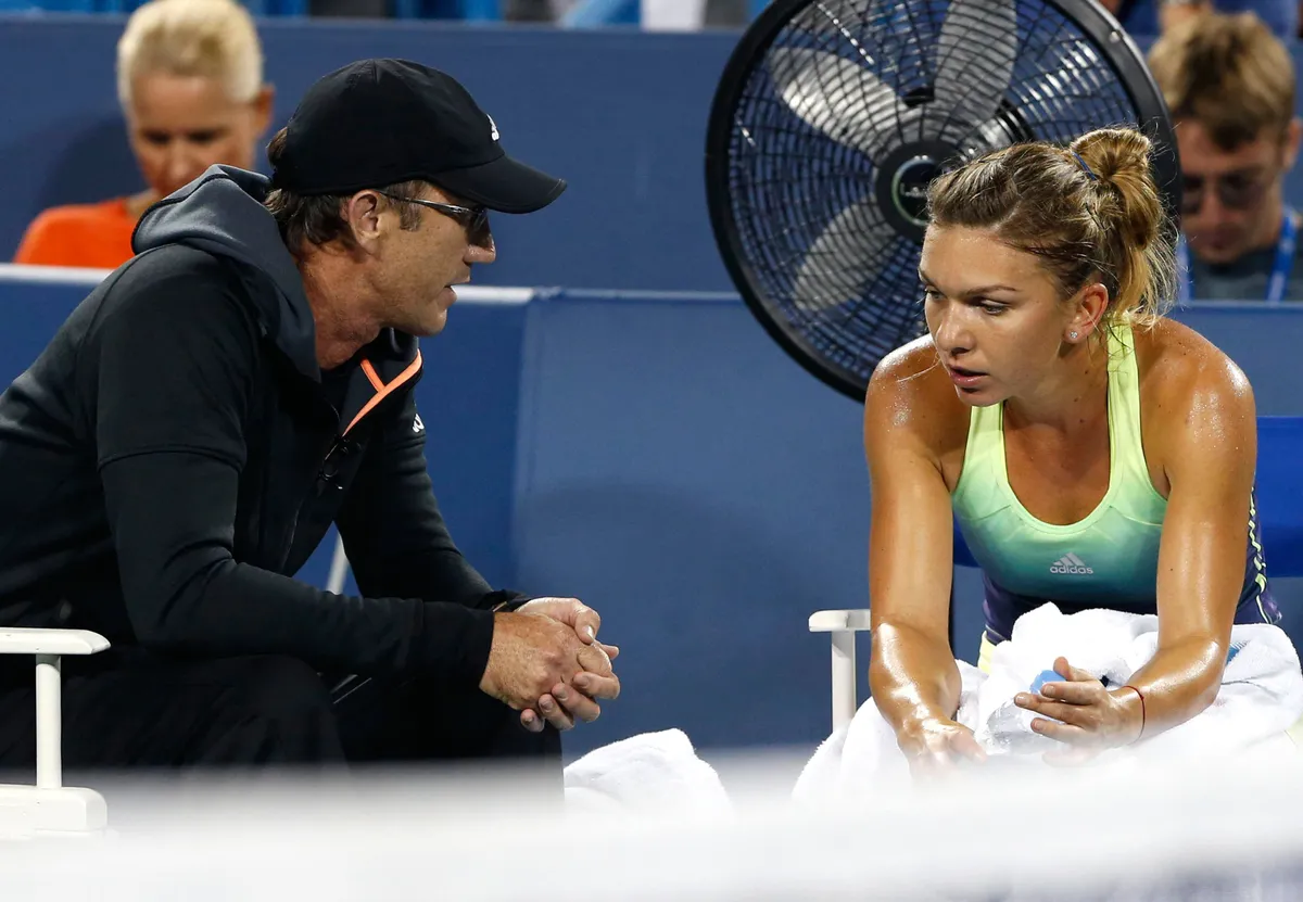 Tennis: Western and Southern Open - Halep vs Jankovic Aug 22, 2015; Cincinnati, OH, USA; Darren Cahill (left) talks with