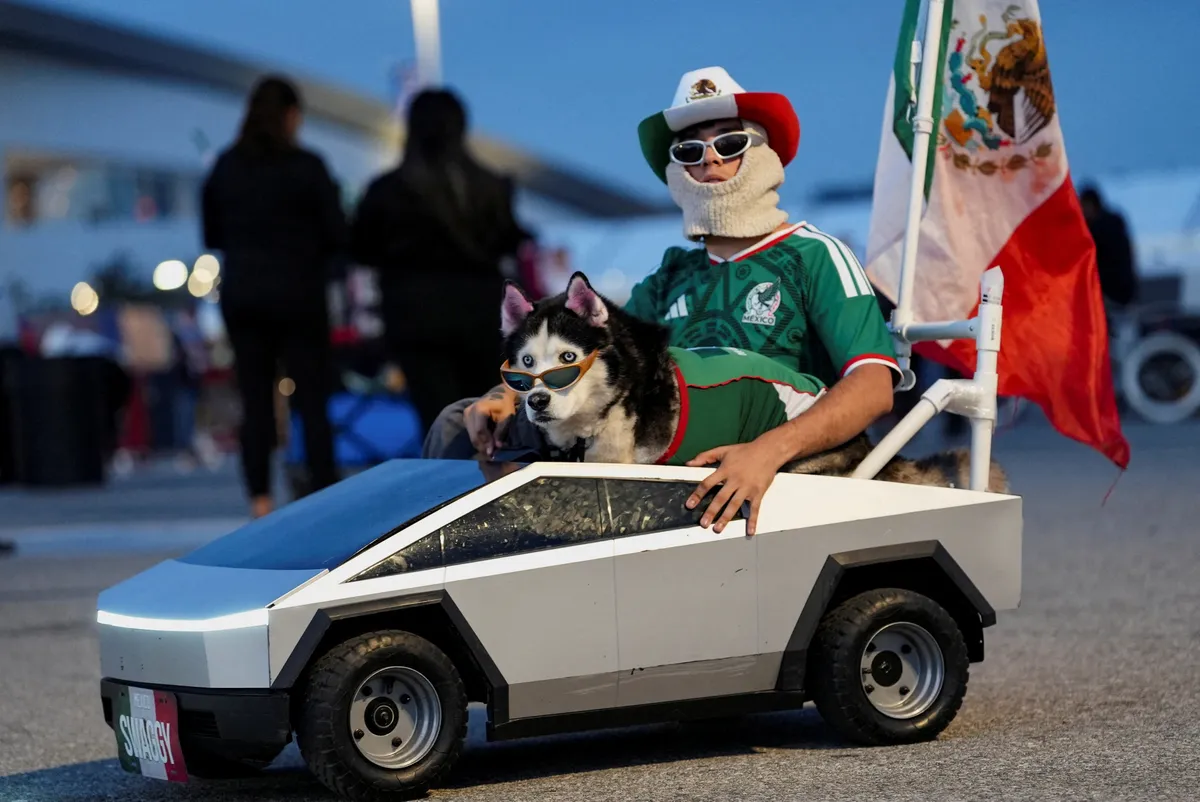 Fan in toy car with dog draws attention outside World Cup venue near Los Angeles